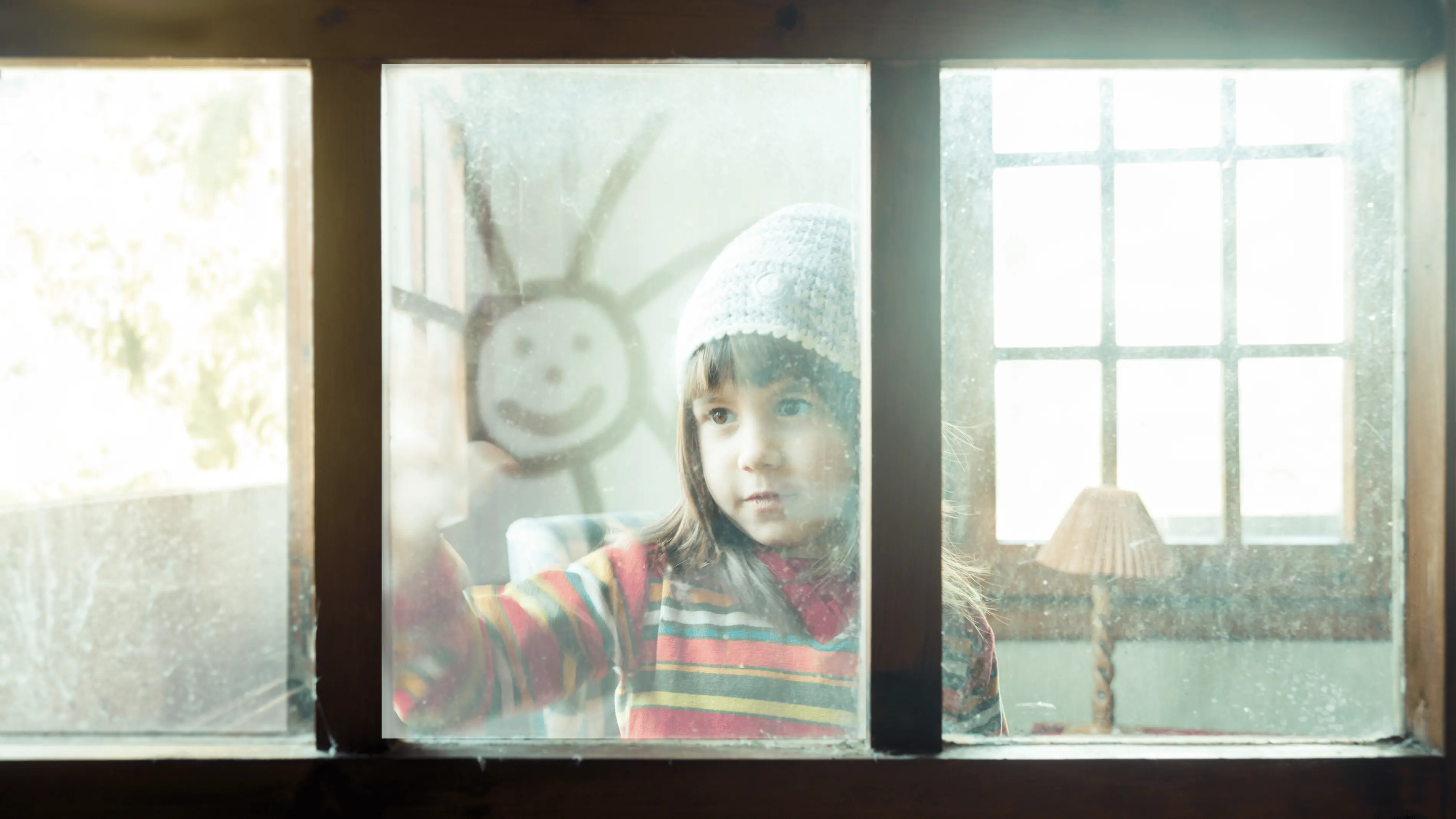 Child looking out a window